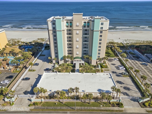 aerial view featuring a view of the beach and a water view