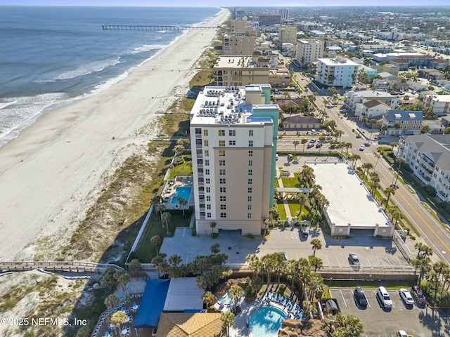 bird's eye view featuring a view of the beach and a water view