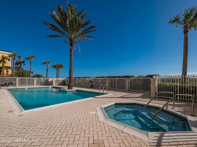 view of pool with a community hot tub