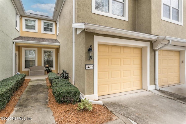 doorway to property with a garage