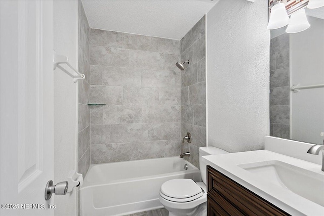 bathroom featuring a textured ceiling, a textured wall, toilet, vanity, and bathing tub / shower combination