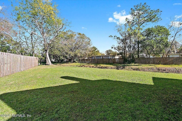 view of yard featuring fence private yard