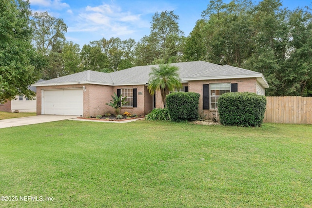 single story home featuring a garage and a front yard