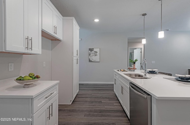 kitchen with dishwasher, decorative light fixtures, white cabinets, and sink