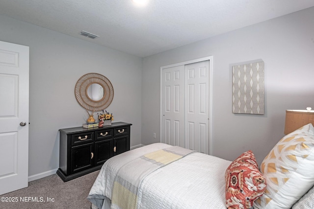 carpeted bedroom featuring a closet