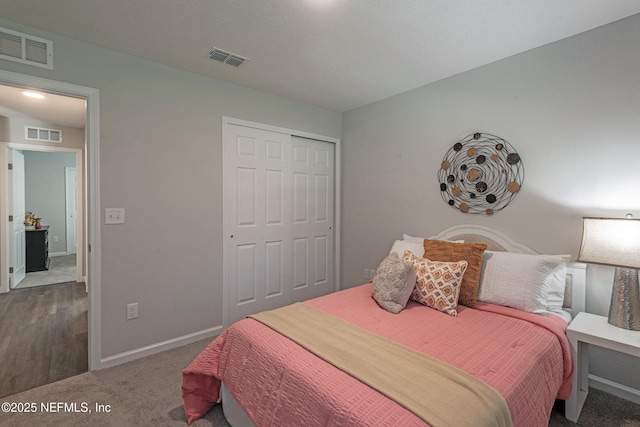 carpeted bedroom with a closet