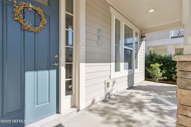 doorway to property featuring covered porch