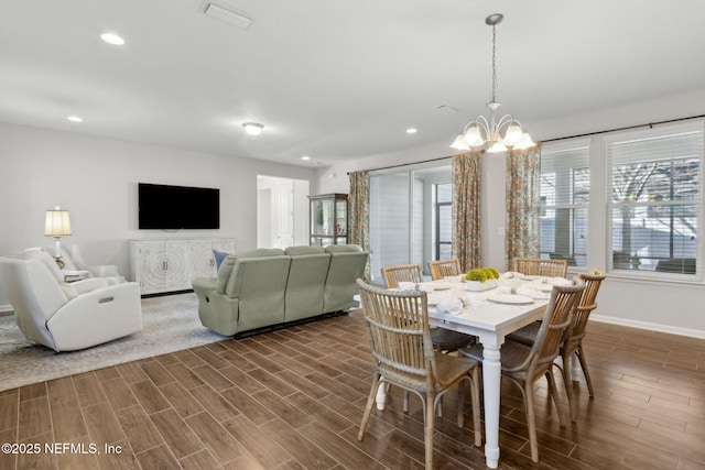 dining area featuring recessed lighting, wood finish floors, baseboards, a chandelier, and visible vents