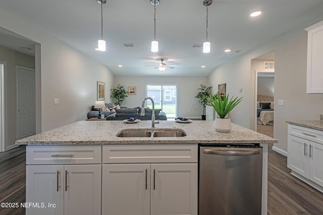 kitchen featuring white cabinetry, sink, ceiling fan, hanging light fixtures, and stainless steel dishwasher