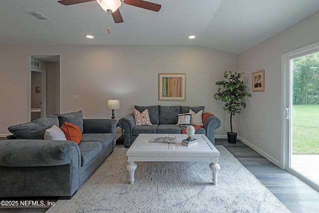 living room featuring ceiling fan, lofted ceiling, and hardwood / wood-style flooring