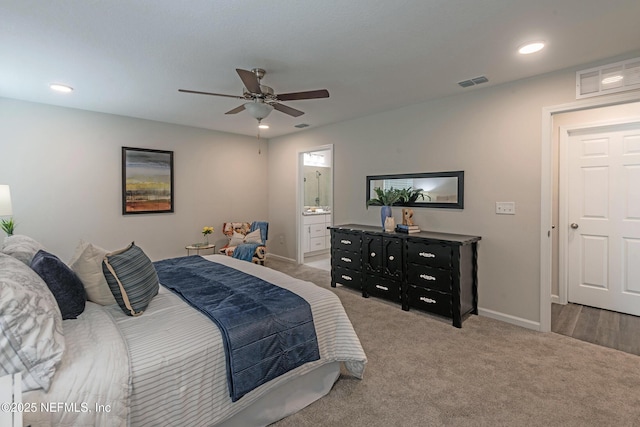 bedroom featuring carpet flooring, ensuite bathroom, and ceiling fan