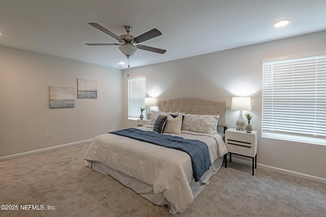 bedroom featuring ceiling fan and light carpet