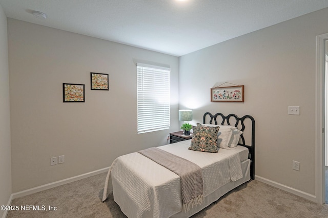 bedroom with light carpet