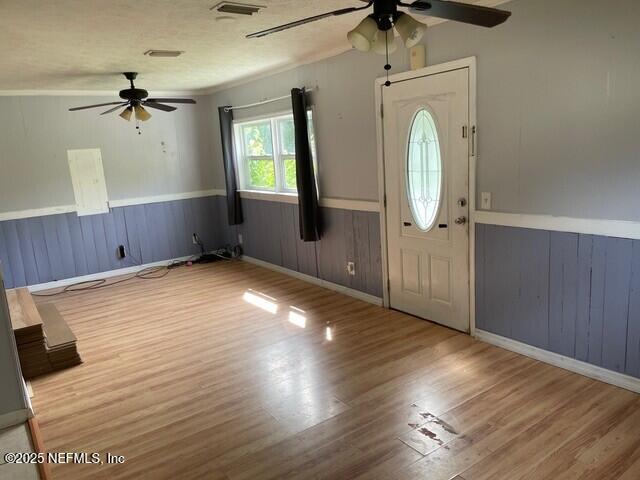 entryway with wood-type flooring