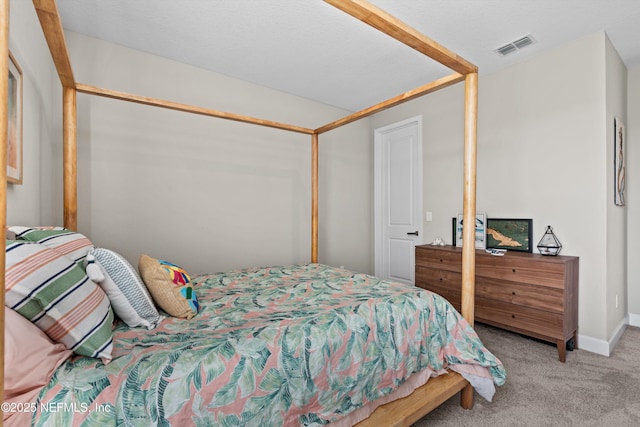 bedroom with light colored carpet