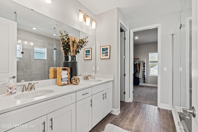 bathroom featuring vanity and an enclosed shower