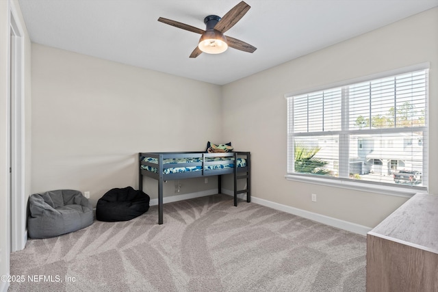 carpeted bedroom featuring ceiling fan