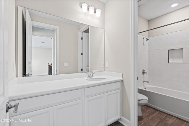 full bathroom with vanity, toilet, and tub / shower combination