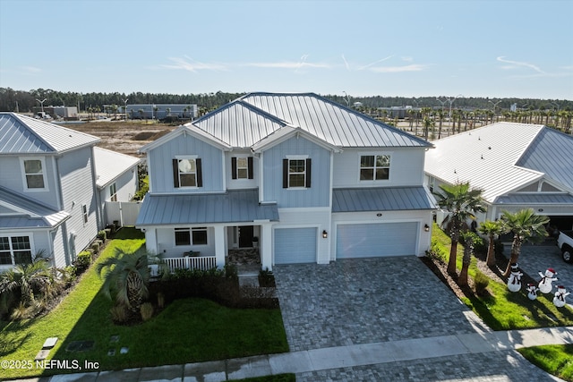 view of front of house with a garage and a front yard