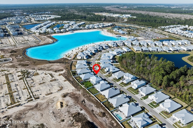 birds eye view of property featuring a water view