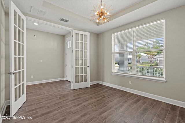 321 Marquesa Cir, Saint Johns, FL 32259 - empty room featuring french doors, a chandelier, dark wood-style floors, and baseboards