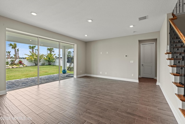 321 Marquesa Cir, Saint Johns, FL 32259 - spare room featuring stairway, baseboards, dark wood-style floors, and recessed lighting