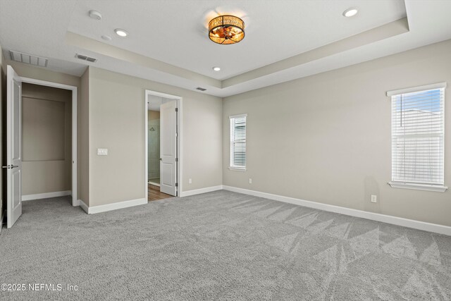 321 Marquesa Cir, Saint Johns, FL 32259 - unfurnished bedroom featuring a tray ceiling, carpet flooring, baseboards, and recessed lighting