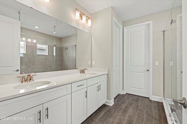 321 Marquesa Cir, Saint Johns, FL 32259 - full bathroom featuring tiled shower, wood finished floors, double vanity, and baseboards