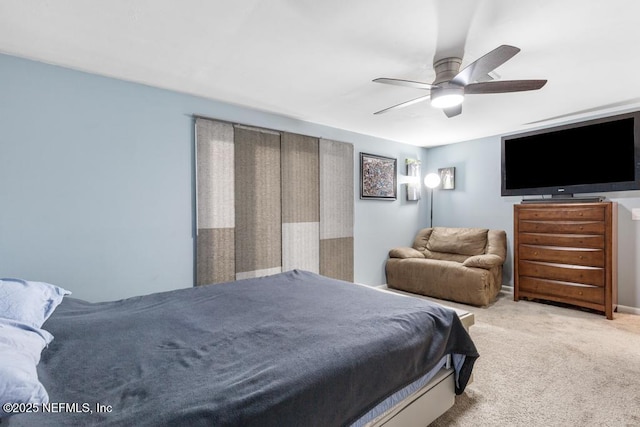 bedroom featuring ceiling fan and light colored carpet