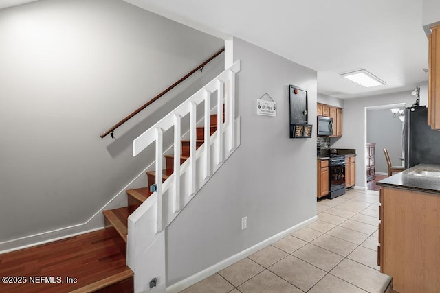 stairway featuring tile patterned floors