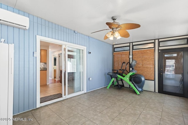 interior space featuring ceiling fan, tile patterned floors, and a wall mounted air conditioner