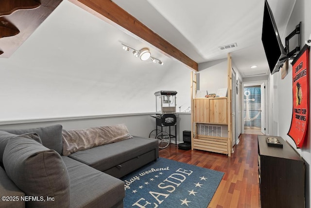 living room featuring dark wood-type flooring and beamed ceiling