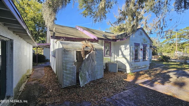 view of property exterior with central AC unit