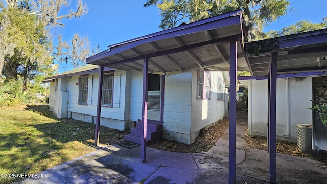 view of side of home featuring a yard