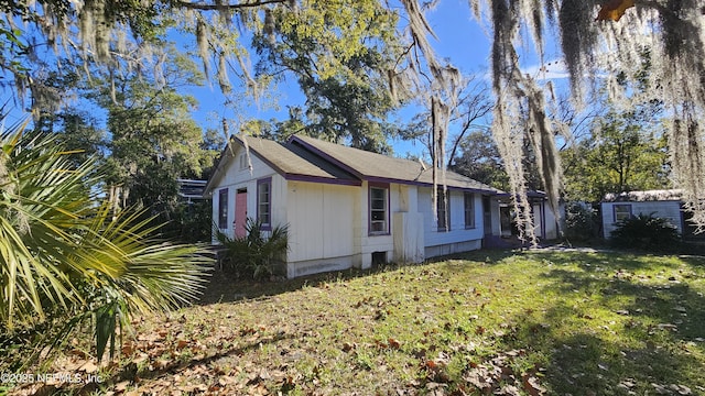 view of home's exterior with a lawn