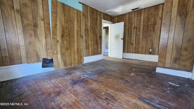 empty room with wooden walls