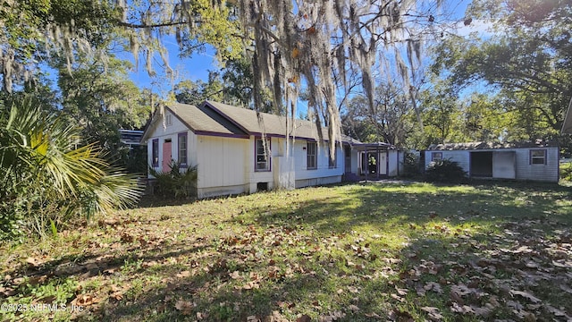 exterior space with a yard and an outdoor structure