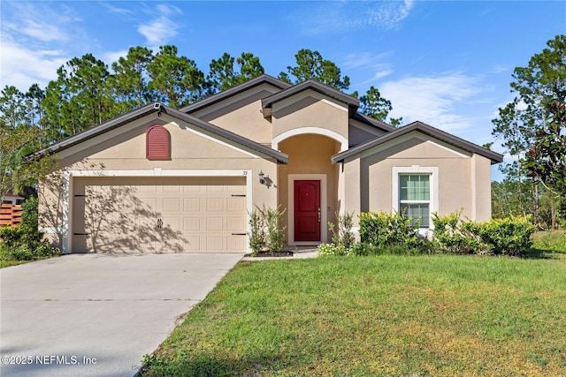 view of front of property with a front lawn and a garage