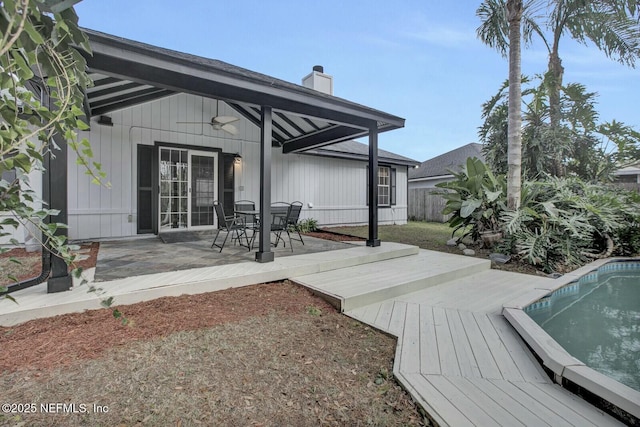 exterior space with ceiling fan and a patio area