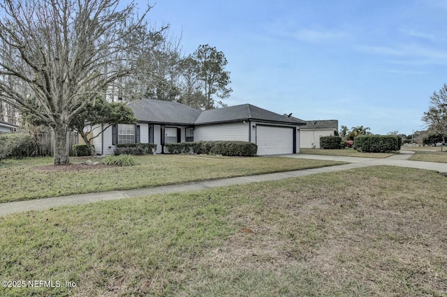 ranch-style home featuring a garage and a front lawn