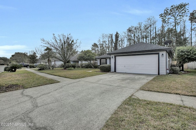 view of front of house with a front yard and a garage