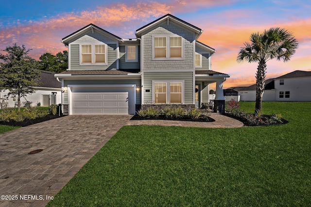 view of front of house with a lawn and a garage