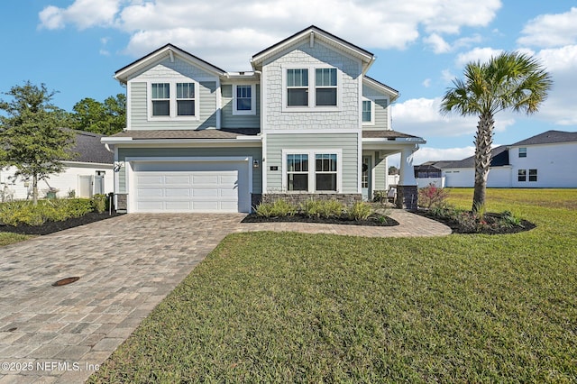 view of front facade with a garage and a front yard