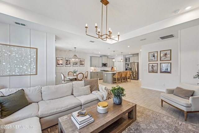 living room with an inviting chandelier