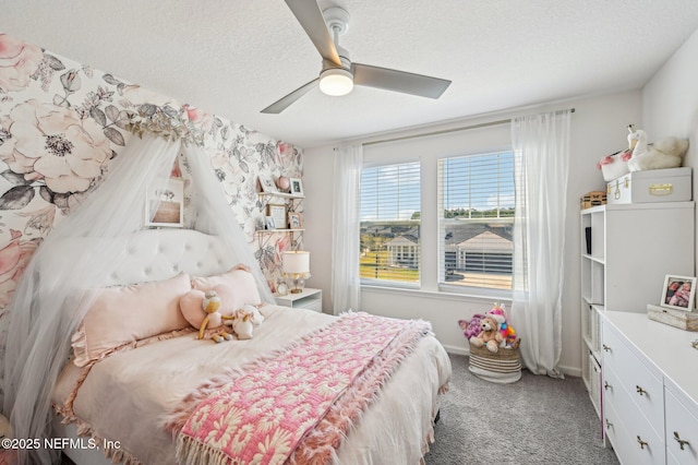 bedroom with ceiling fan, carpet, and a textured ceiling