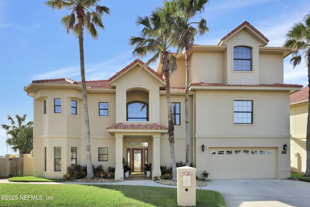 mediterranean / spanish-style house featuring a garage