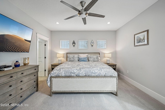 bedroom featuring ceiling fan and light carpet