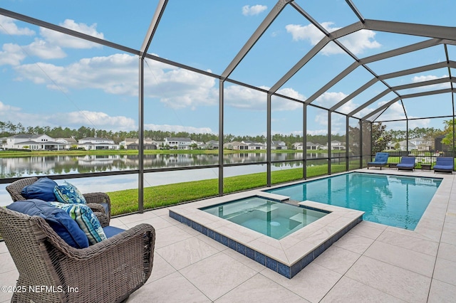 view of pool featuring a water view, a lanai, a yard, an in ground hot tub, and a patio