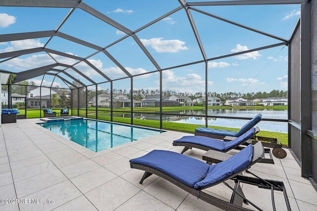 view of swimming pool featuring a lanai, a yard, a patio, and a water view