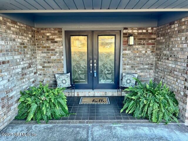 doorway to property featuring french doors